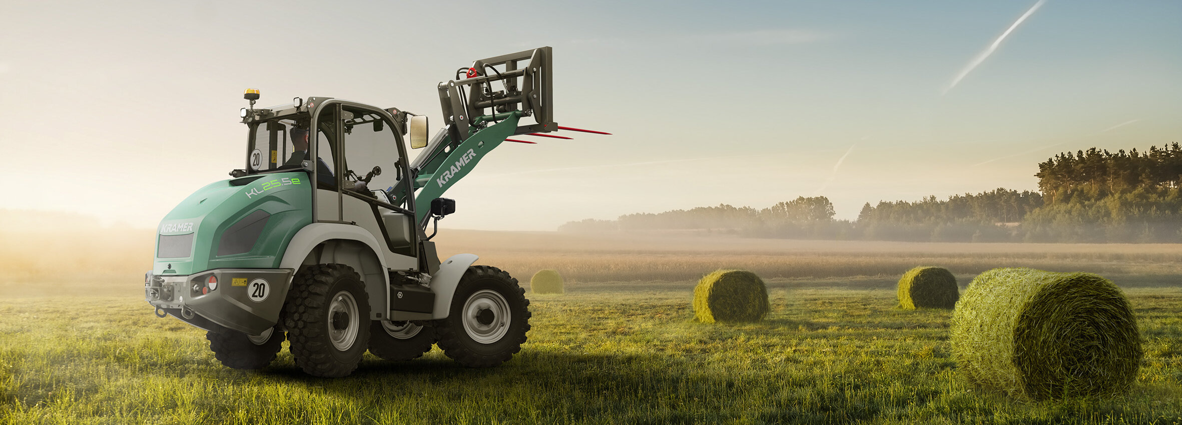 Kramer wheel loader on a green field
