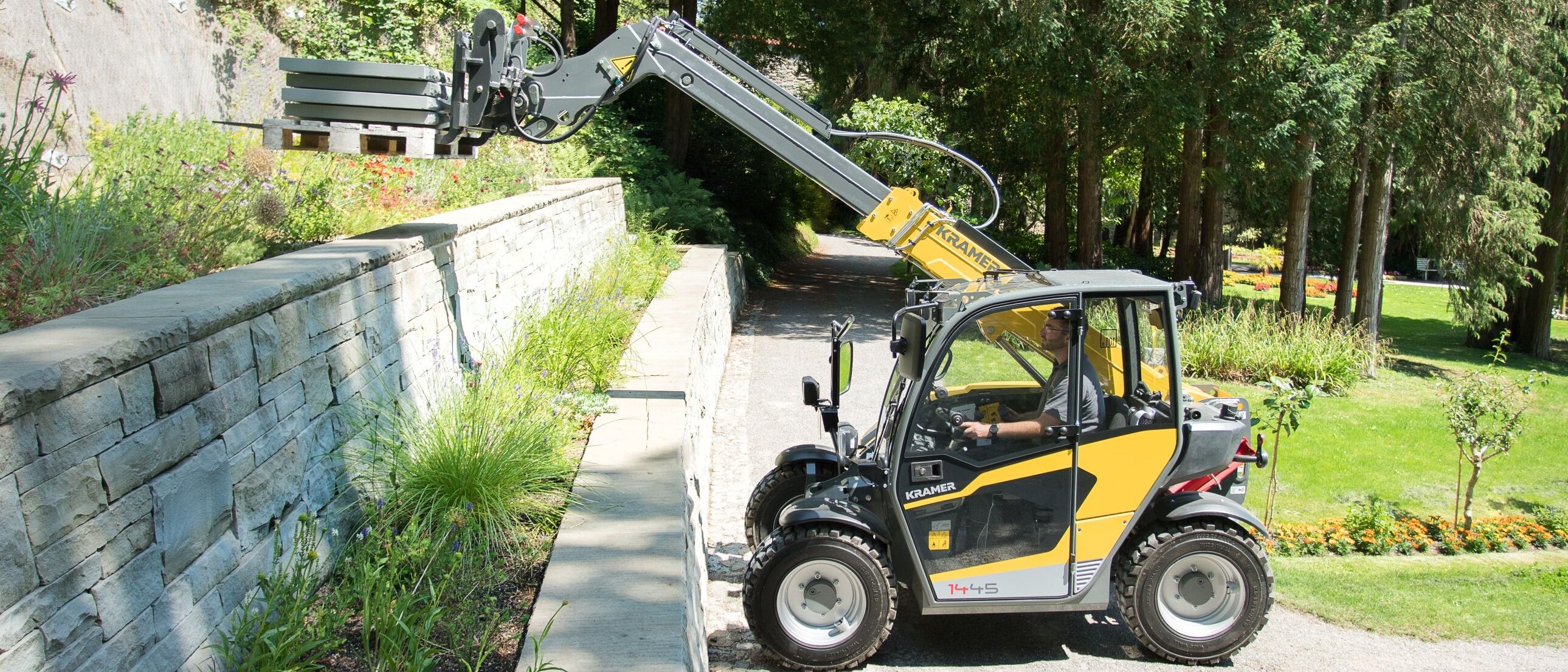 Kramer telehandler transporting concrete plates